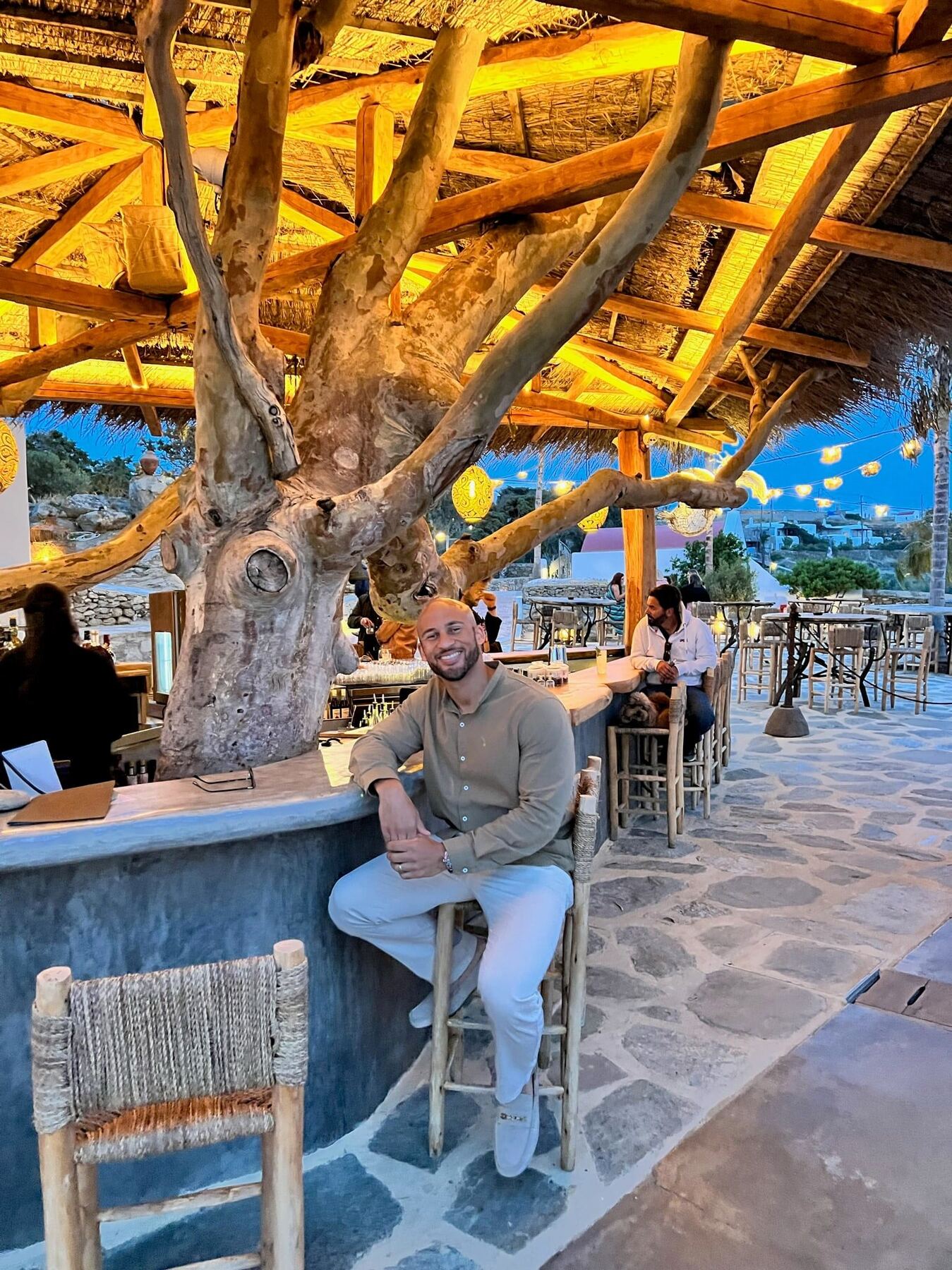Michel, the planner behind Wyn & Wander, at a Mykonos terrace